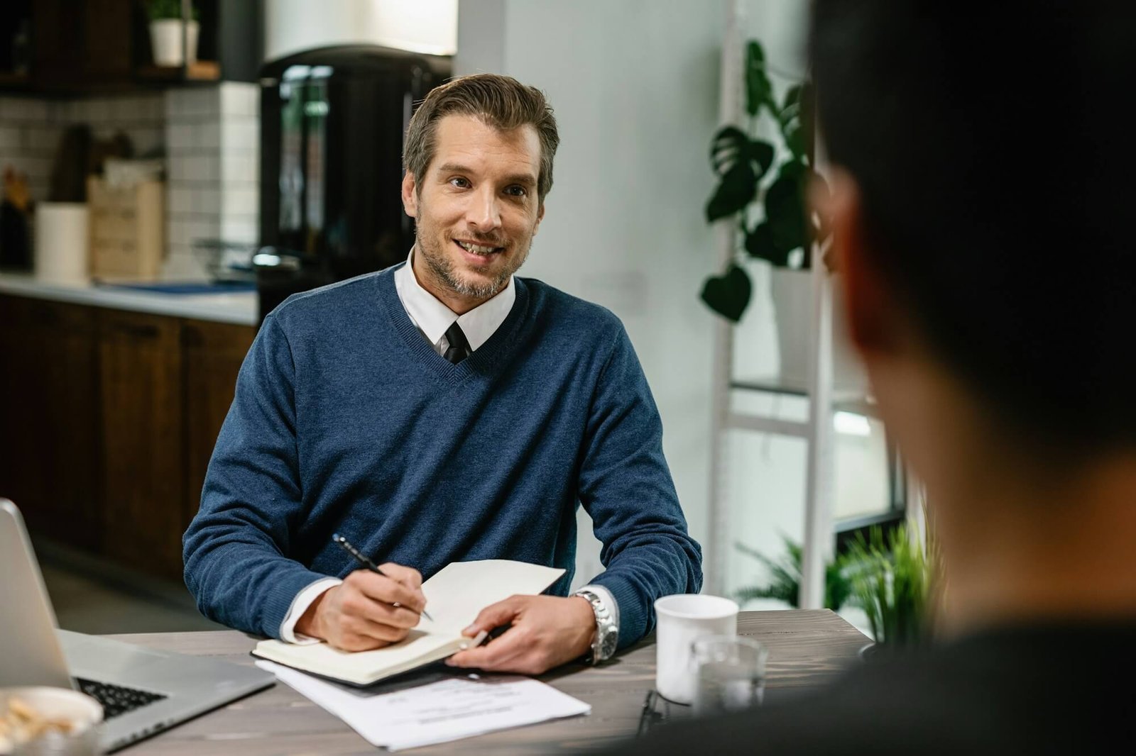 financial-consultant-planning-home-finances-with-his-client-.jpg